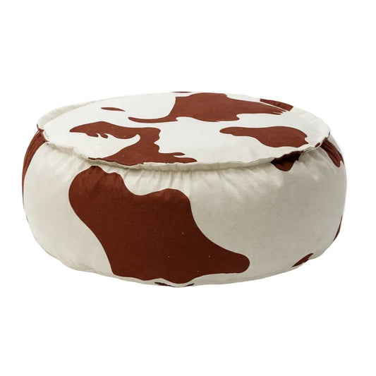Ronde kinderpoef uit de Cow Collection met zwart-witte koeienprint en zachte stoffen bekleding