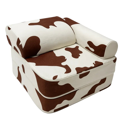 Bees & Blooms modulaire kinderstoel met koeienprint uit de Cow Collection voor spelen, lezen en ontspannen